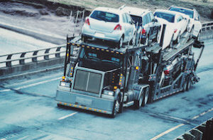 Auto transport semi drives on the open highway